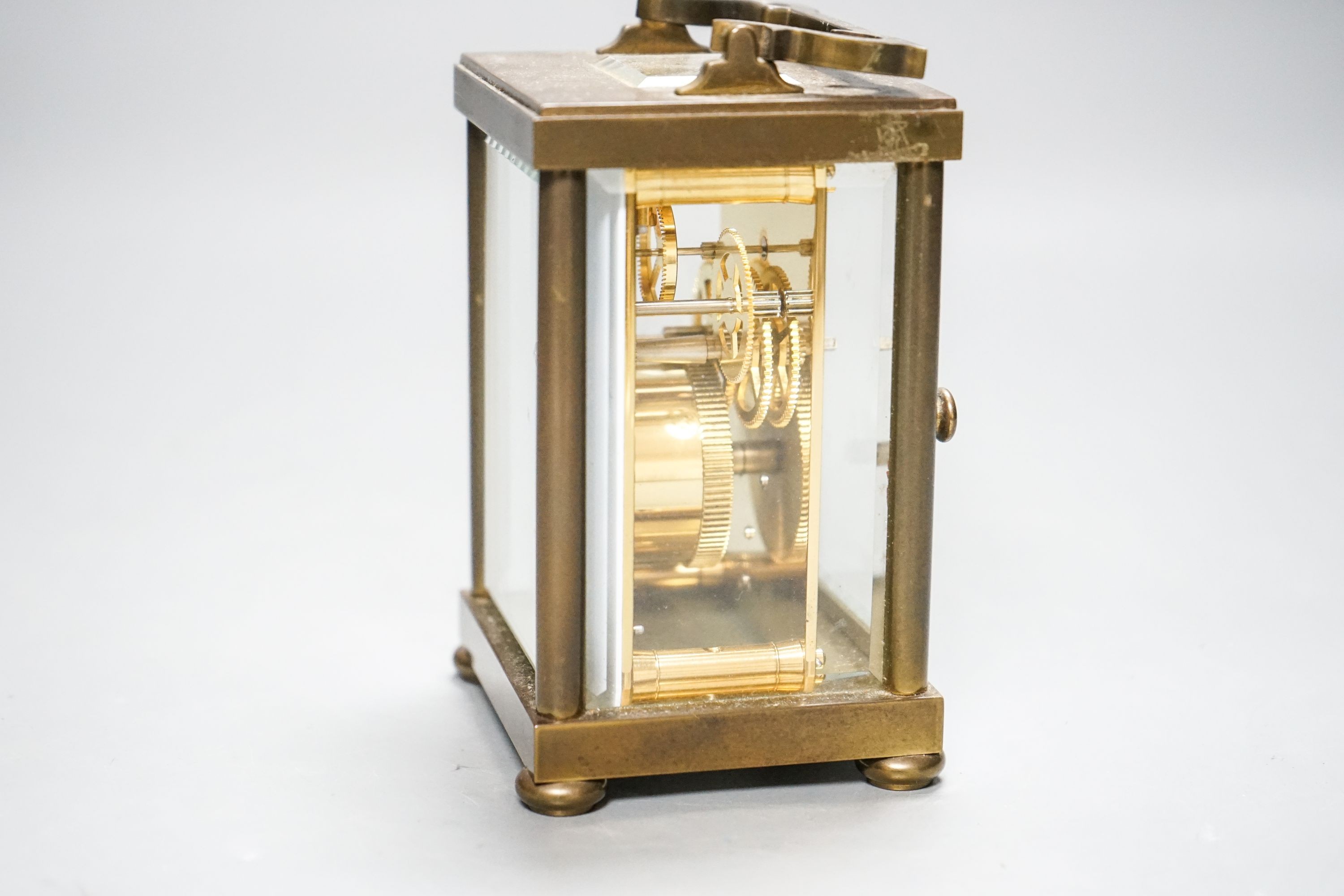 A Matthew Norman brass carriage timepiece, 15 cm high with the handle up